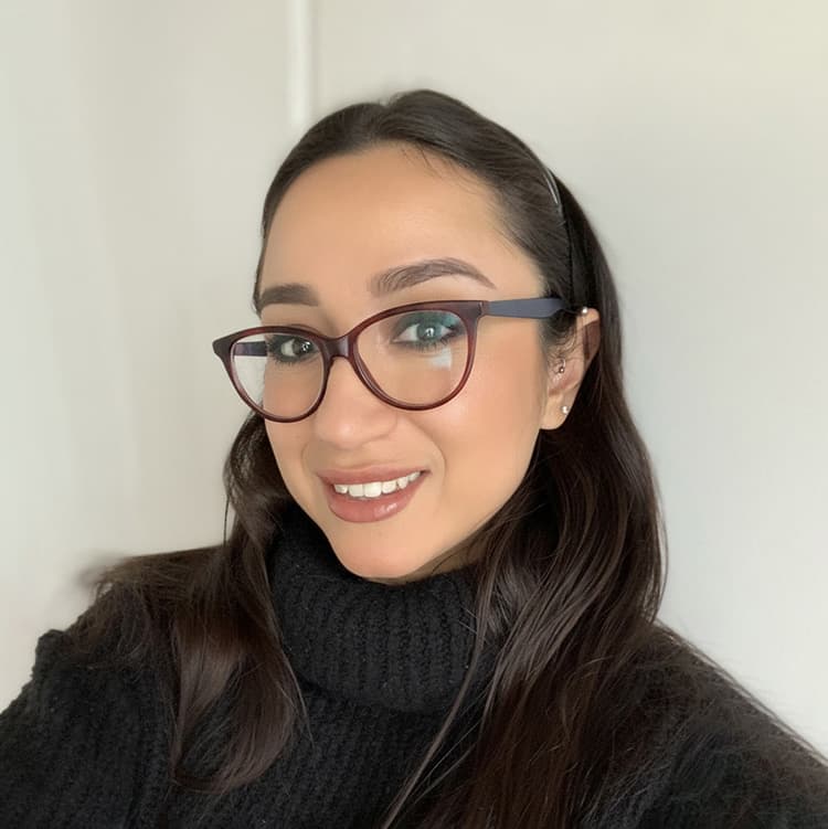 Photo of female with glasses smiling